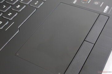 Touchpad surface is completely smooth with no bumpy texture. Still, it's quite small for a large 17.3-inch display
