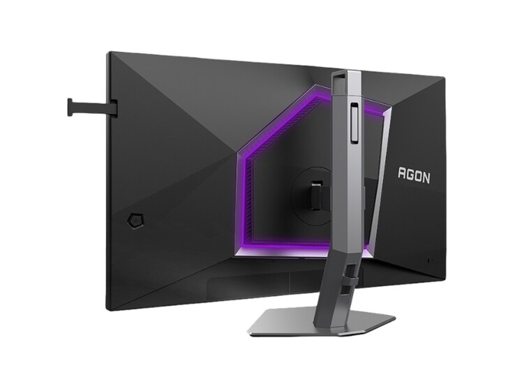 Resimde, mor RGB ışıklandırmasıyla oldukça oyun odaklı bir tasarıma sahip AOC Agon Pro AG276UZ oyun monitörünün arka kısmı gösterilmektedir. 
