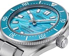Seiko Prospex 1965 Heritage Diver saatinin mavi kadranı, tarih göstergesi, ışıklı ibreleri ve işaretleri ile paslanmaz çelik kasasını gösteren yakın çekim.