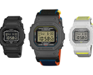 Resimde Casio G-Shock DW-5600MNC-1, DW-5600MNC-BA2 ve DW-5600MNC-7A8 beyaz bir arka plan üzerinde gösterilmiştir.