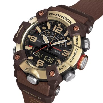 G-Shock Mudmaster GG-B100XMH-5A modelinin dijital-analog ekranını ve açık sarı ile kahverengi renk şemasını gösteren açılı bir görünüm.