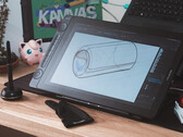 Huion Kamvas 16 Gen 3, stylus çizim eldiveni ve klavye ile masa üzerinde