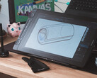 Huion Kamvas 16 Gen 3, stylus çizim eldiveni ve klavye ile masa üzerinde