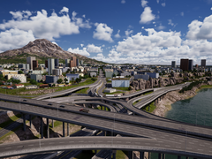 Arka planda gökdelenler ve binalar ile karmaşık yol ağlarını gösteren Şehir Master Planından bir ekran görüntüsü